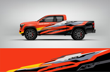 Obraz premium Orange and black pickup truck wrap with aggressive streak graphics and sharp contrast. Editable vector EPS format included.