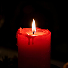 red candles in the dark
