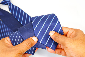 Neckties holding hands on white background close-up view, Different types of neckties showing hands...