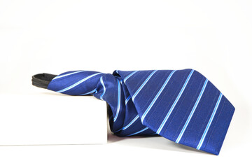 A blue tie macro photography with white background 