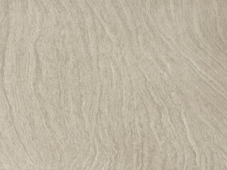 Close up of light beige stone texture with random wavy pattern. Seamless background texture.