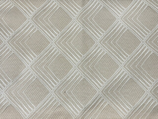 Close up of graphic background in random diamond pattern in silver and brass gold beige color....