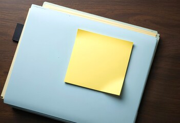 A blank yellow sticky note mockup is attached to an office file cover