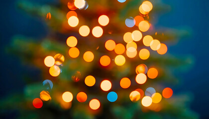 Fototapeta premium Warm and vibrant bokeh lights from a Christmas tree creating a soft, magical festive background with glowing orange and blue spheres