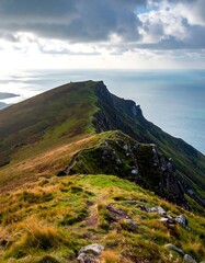 Mountain ridge path overlooking ocean. Dramatic clouds