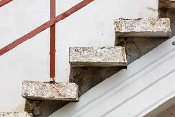 A staircase made of bricks with a red stripe