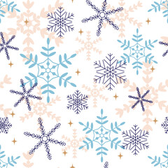 Christmas seamless multi-layered pattern with snowflakes with different patterns. Blue, blue-violet, golden on a white background