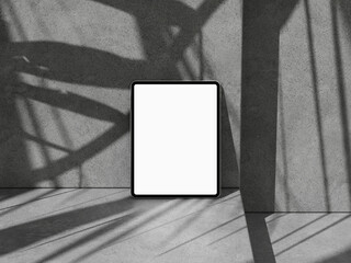 Tablet mockup with abstract wheel shadows on concrete wall for web or app.
