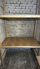 Rustic shelving in dim cellar, evoking vintage charm, ideal for Winter Solstice storage or obscure Canning Day preparations
