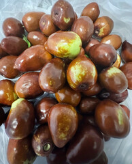 Rich maroon salak fruit glistens under sunlight, mystical Bali harvest ritual, exotic taste adventure, tropical bounty celebration