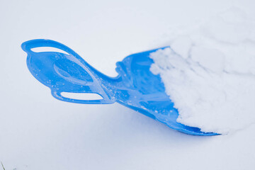 Sled with fresh snow ready for winter fun in a snowy landscape