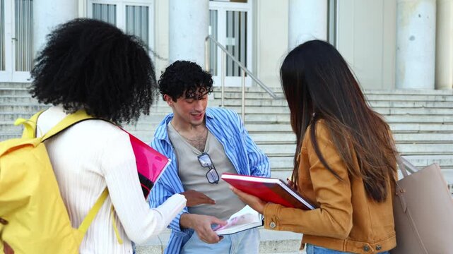University students discussing schoolwork on campus stairs