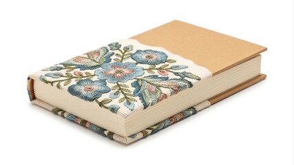 Elegant fabric-covered book featuring intricate blue floral embroidery, highlighting traditional textile art and meticulous craftsmanship, presented on a white background
