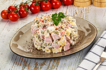 Russian traditional Olivier salad with sausages
