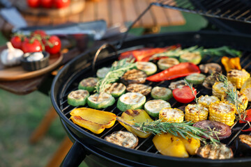 Vegetarian barbeque. Grill with different cooked vegetables outdoors, closeup