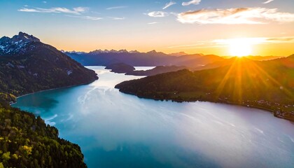Aerial view of a stunning lake scene at sunset, with a body of water nestled between mountainous terrain
