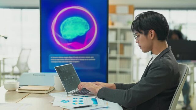 Business professional concentrates in coworking space leveraging AI powered virtual assistant and realtime big data analytics on laptop display for hyper automated workflow intelligence optimization	