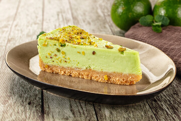 Green pistachio cheesecake served mint