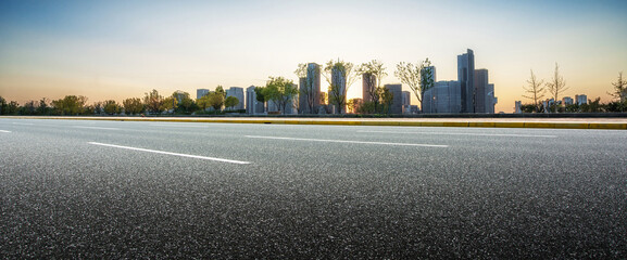 Urban Sunset Skyline with Open Road Perspective