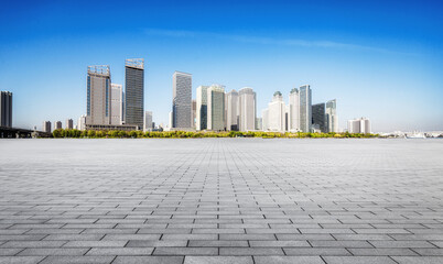 Expansive Urban Skyline with Modern Architecture Against a Clear Blue Sky