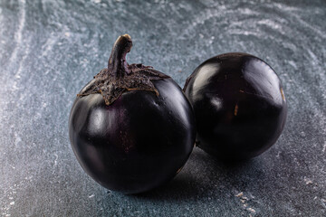 Raw round black big eggplant