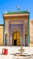 Ornate, arched gateway, vibrant colors,  historic Moroccan structure