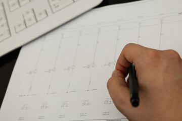 Engineer drawing electrical circuit diagram
