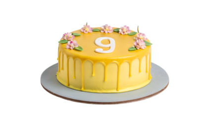 Vibrant yellow number 9 birthday cake decorated with pink flowers and drips isolated on transparent background
