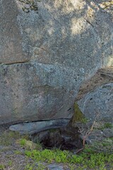 Obraz premium Closeup of cylindrical Nupuri giant´s kettle, also known as giant´s cauldron, moulin pothole or glacial pothole in summer, Nupurinkallio, Espoo, Finland