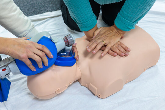 CPR and First Aid Training — Practical Tactical Medicine Class with CPR Manikin and Ambu Bag Demonstration for Civilian and Military Medical Preparedness - Powered by Adobe