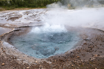 Bubbling hot spring seen at the Geysir geothermal area in Iceland