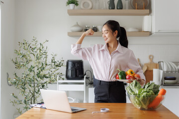 Woman showing strength, living healthy with fresh vegetables
