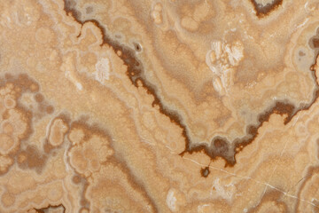 Onice Cappuccino background. Perfect texture in beige tone for your design. Slab photo.