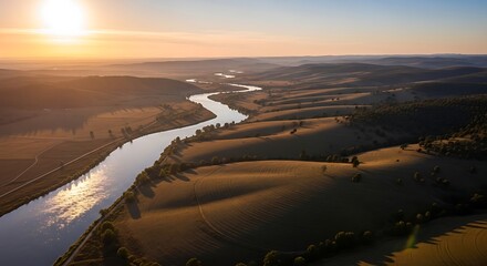A stunning landscape photo captures a serene sunrise over a misty river and a vivid sunset over the rugged mountains