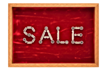 Word sale spelled out with keys on a red velvet background isolated on transparent background