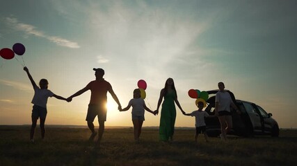 holding balloons. Family holiday with balloons at sunset. Kids enjoying holiday, colorful balloons. family gathering with balloons. Family memorable holiday moment. Sunset family holiday celebration.