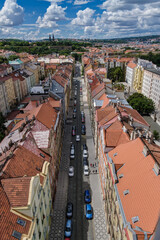 Breathtaking panoramic view of Prague, showcasing its historic city center with iconic buildings, charming red-roofed houses.