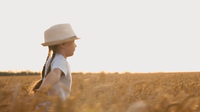 agriculture, wheat field, golden wheat farm field sunset, little girl running through wheat field at sunset, child kid girl daughter running at sunset, child in hat at sunset, happy family, superhero