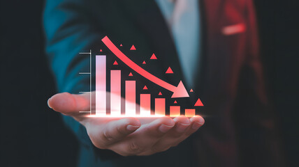 Businessman displays financial decline graph showing downward trend and loss, symbolizing market crash.