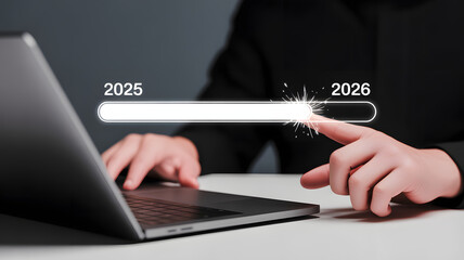Excitedly advancing to the new year, a finger presses a progress bar from 2025 to 2026.