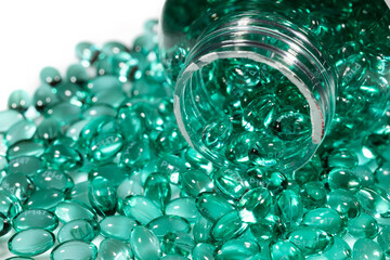 Blue capsules in the shell with liquid vitamin. Blue capsules with a dietary supplement for joints teeth and bones