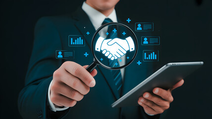Professional analyzing business partnership growth with digital data insights and magnifying glass