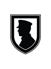 Silhouette of a man in a cap within a shield emblem