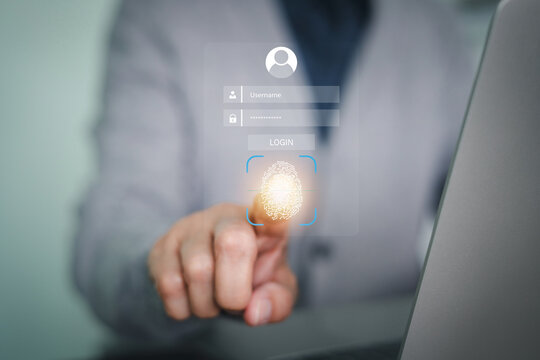Person using fingerprint scan for biometric login authentication on a laptop. Concept of passwordless entry, data protection, and personal identity verification in the modern digital world.