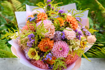 Summer bouquet. Beautiful pink, purple, blush and orange fresh flower arrangement. Birthday or weddding bouquet made of summer flowers.