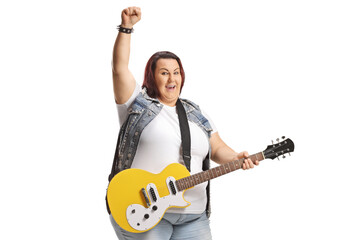 Young female rocker with an electric guitar gesturing with hand