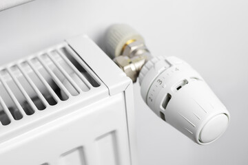 Radiator with thermostat valve in the home