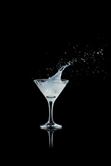 White cocktail splash captured in mid-air with dynamic motion. Concept of celebration, energy, and nightlife used in bar culture, event visuals, and beverage industry promotion.