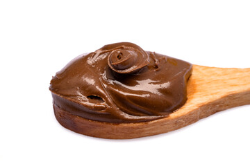 Cream chocolate with spoon on a white background