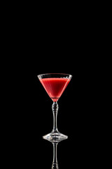 Red martini drink in elegant glass on black reflective background. Concept of sophistication, calm mood, and luxury style for product, design, and visual branding.